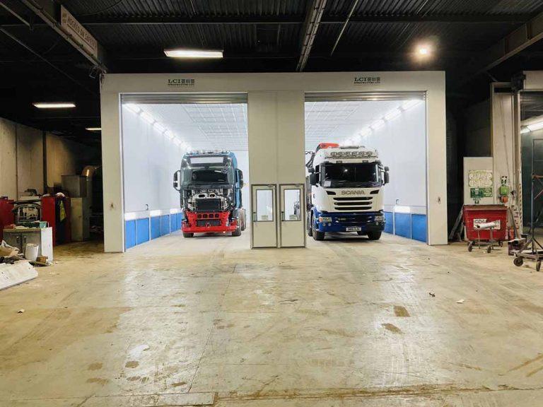 two trucks in spray booths